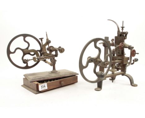Two watchmakers rounding up tools both require attention G- 