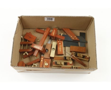 Four rosewood and brass planes, four gauges,four square and six other miniature tools all by SANDERSON N