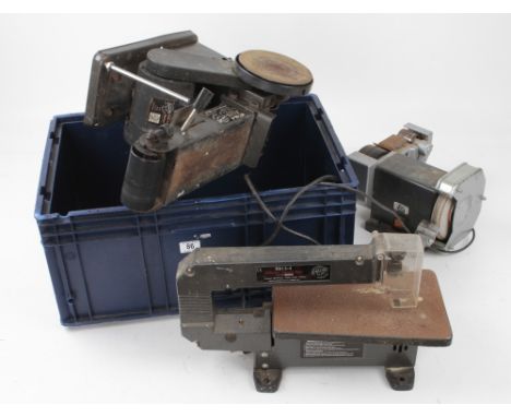A scroll saw, grinder and belt sander G-