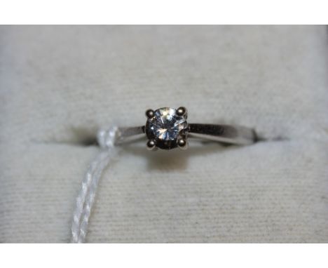 A diamond solitaire ring, the stone 0.5ct. In gold marked 750. Size K