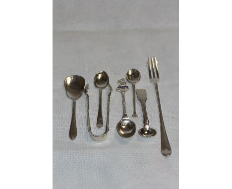 Silver smallware comprising a sugar bow, pickle fork and five spoons. 4ozs