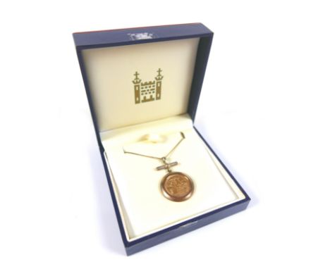 An ERII gold half sovereign, 2004, with 9ct gold mount set with a bar of small round cut diamonds, on a 9ct gold necklace, ch