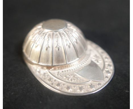 A novelty caddy spoon, modelled as a racing cap, marked Francis Howard Ltd, Sheffield 1971, 5.3 by 4.1 by 1.7cm high, 0.36toz