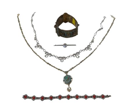 A small group of costume jewellery, comprising a moonstone bar brooch, 9.0mm cabochon, 5.9cm, a Persian 900 silver hinged ban