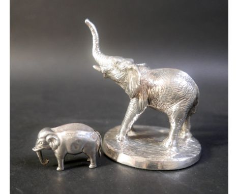 An Adie & Lovekin Ltd novelty pin cushion modelled as an elephant, Birmingham 1906, 5cm long; together with a filled silver m