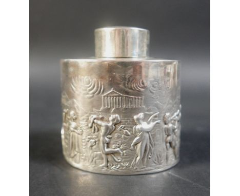 An Edwardian silver tea caddy, of oval form, decorated in a repousse style design with Greek mythological allegorical scenes,
