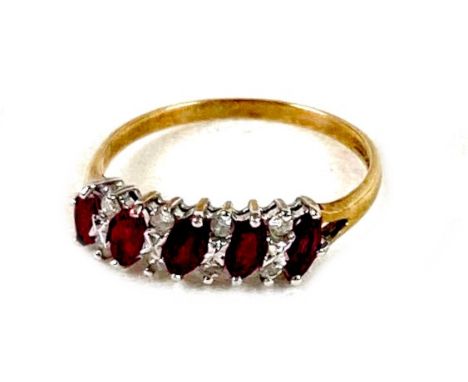 CATALOGUE AMENDMENT: 9ct NOT 18ctA 9ct yellow gold, ruby and diamond ring, set with five oval cut rubies, each 4.0 by 2.5mm, 