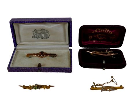 A group of four 9ct gold bar brooches, comprising a 19th century ruby and seed pearl brooch, 4.4cm long, boxed; a gold and ci