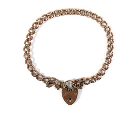 A 9ct rose gold curb link bracelet, with heart shaped padlock clasp and safety chain, 0.6 by 20cm long, 16.2g. 
