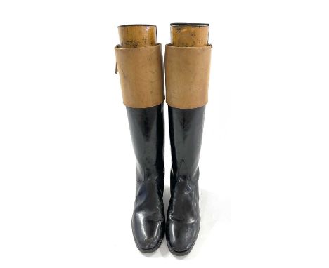 Pair of light brown leather tot hunting right boots with wooden trees