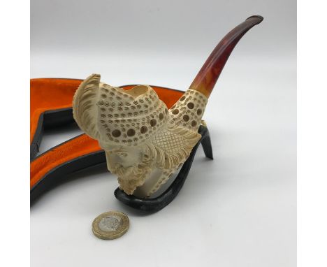 A Highly detailed carved meerschaum pipe with stand and case. 