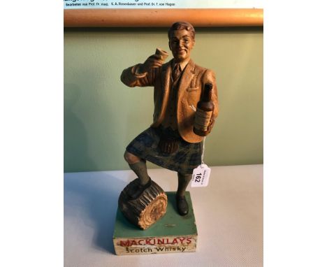 A 20th century Mackinlays scotch whisky advertising figure of a kilted figure, 35cm in height 