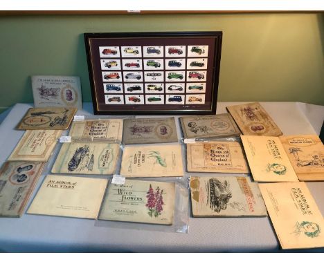 A quantity of cigarette card albums, together with a motor car cigarette card presentation in frame 