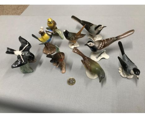 A Lot of 9 Goebel bird figures includes White wagtail, Yellow Wagtail, Robin, Blue Titmouse &amp; Yellow Hammer. 