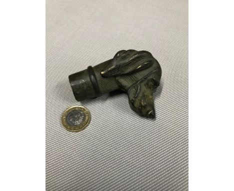 A Bronze walking stick top in the design of a gun dog. 