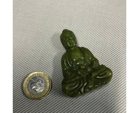 A Carved Jade oriental God ingot