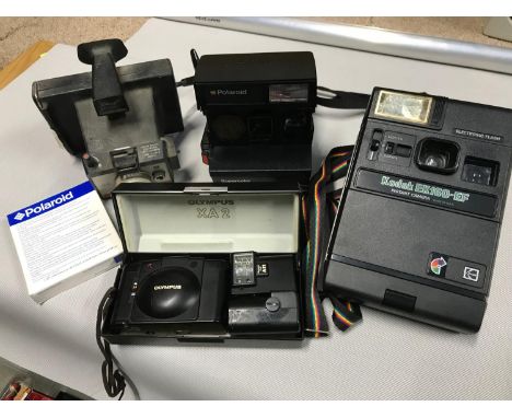A Lot of vintage cameras which includes Polaroid Supercolor 670AF, Polaroid Colorpack 80, Kodak EK160-EF &amp; Olympus XA2 Ca