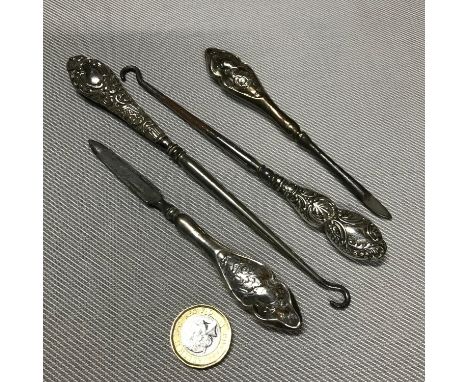 A Lot of 4 silver handled manicure utensils and button hooks