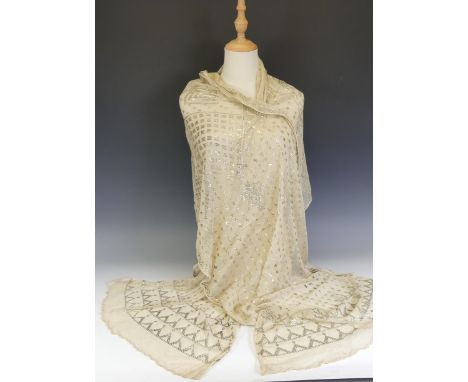 Vintage fashion; an early 20thC Egyptian Assuit dark cream and yellow metal shawl, the whole with geometric decoration, L 220