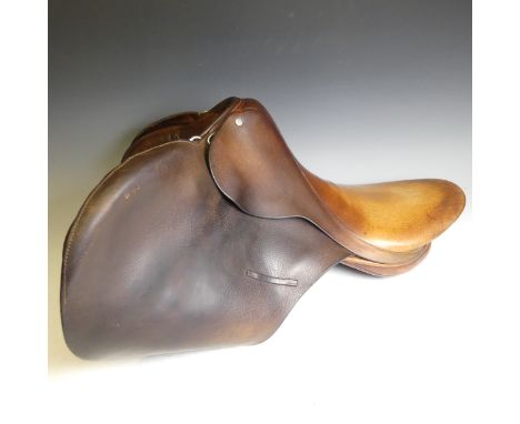 A Lovatt &amp; Ricketts leather Saddle and a 19thC driving Whip by 'Crawley &amp; Sons of Peterborough', with brass ferals on