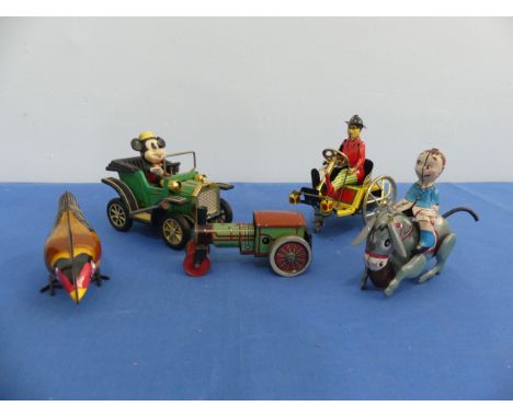A tinplate clockwork donkey with rider, made in Japan with GR trademark, with key and in working order, together with a clock