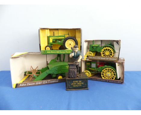 Four ERTL diecast 1:16 scale John Deere models comprising: a 1940 12A combine, a 1915 model R Waterloo Boy Tractor, No 559, a