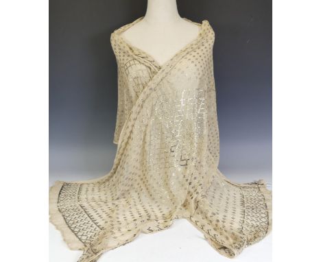 Vintage fashion; an early 20thC Egyptian Assuit cream and yellow metal shawl, the whole with geometric decoration, L 260cm x 