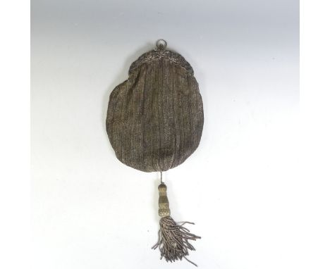 Vintage fashion accessories; an early 20thC continental silver and fabric evening tassel bag, the continental silver clasp mo