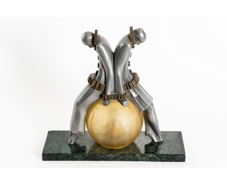 AN ART DECO ALUMINIUM AND BRASS ‘PIERROT’ FIGURAL TABLE LAMPEarly 20th Century 
Inscribed to the cast ‘EXE 3’, with yellow fr