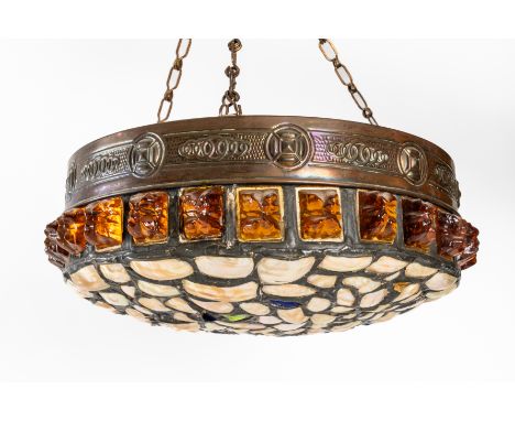 AN AUSTRIAN ARTS AND CRAFTS COPPER, AMBER AND MOTHER-OF-PEARL 'CHUNK GLASS' HANGING LIGHT SHADEProbably circa 1920s 
The dome