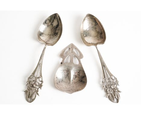 TWO SIMILAR SILVER SPOONS AND A SILVER CADDY SPOON (3)The two spoons with pierced floral and foliate decoration to the handle