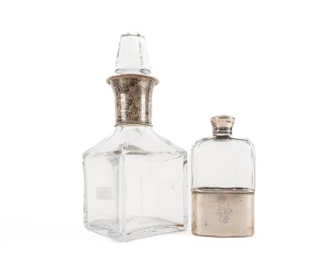 A SILVER MOUNTED GLASS SPIRIT FLASK AND A EUROPEAN SPIRIT DECANTER (2)The spirit flask with a pull-off beaker base, London 18