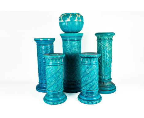 A SMALL PAIR OF BURMANTOFTS FAIENCE TURQUOISE GLAZED CYLINDRICAL PEDESTALS (6)Circa 1900
Each decorated with stylised wave an