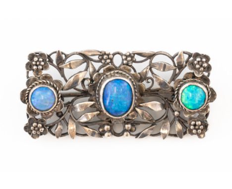 ARTHUR AND GEORGIE GASKIN - AN OPAL BROOCHSet with three opals, in an openwork floral surround, signed G to the reverse and a