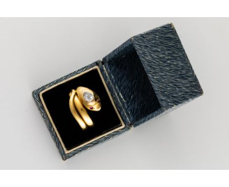 A VICTORIAN DIAMOND AND RUBY SNAKE RINGThe ring in the form of a coiled snake, the head bezel set with cabochon ruby eyes and