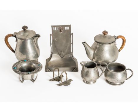 LIBERTY & CO: A PEWTER FOUR PIECE BACHELOR TEA AND COFFEE SERVICE (8)20th Century
The hammered four piece service stamped Lib