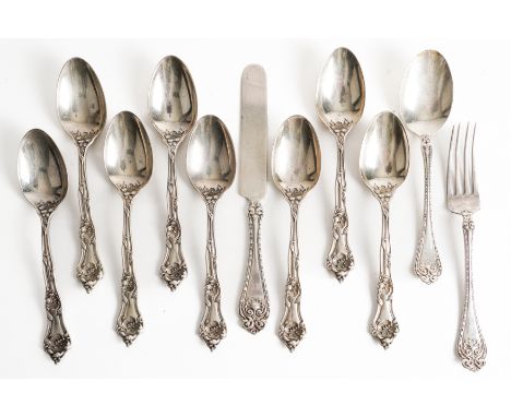 A GROUP OF STERLING TABLE FLATWARE (11)Comprising; eight large teaspoons, with floral decoration and a three piece christenin