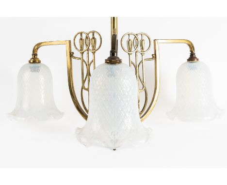 AN ART NOUVEAU BRASS THREE BANCH HANGING LIGHTEarly 20th Century 
With downward swept arms with upright stylised flower stems
