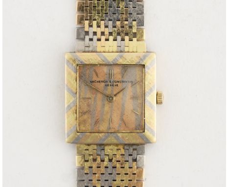 VACHERON & CONSTANTIN: A TRI-COLOUR 18K GOLD MANUAL WIND WRISTWATCHCirca 1963, the textured square dial with applied gilt bat