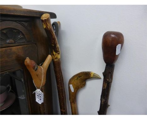 FOUR VINTAGE SHEPHERD'S STICKS with various carved handles including eagle, dog, bird etc (4)