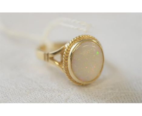 9ct GOLD OPAL SET DRESS RING with decorative splayed shoulders, size M