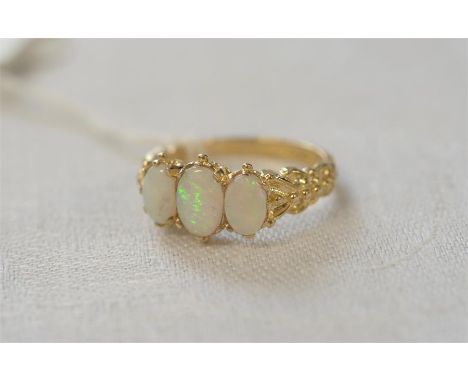 9ct GOLD THREE GRADUATED OPAL DRESS RING with floral shoulders, size M