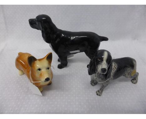 COLLECTION OF BESWICK AND OTHER DOG ORNAMENTS comprising spaniel, springer spaniel and a corgi (unmarked) (3)