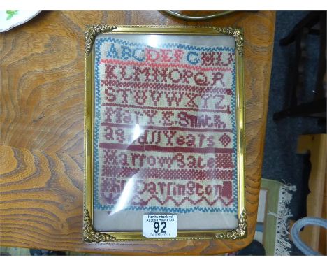 SMALL WOOLWORK SAMPLER by Mary Smith aged 11 years, with alphabet, set in later frame, approximately 19cms x 16cms