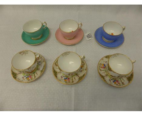 SIX GROSVENOR CHINA DEMITASSE CUPS AND SAUCERS comprising three floral and three harlequin (12) 