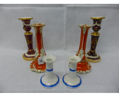 THREE PAIRS OF VICTORIAN CERAMIC CANDLESTICKS with floral and gilt detail, graduated sizes 24cms, 22cms and 11cms (a/f) (6)