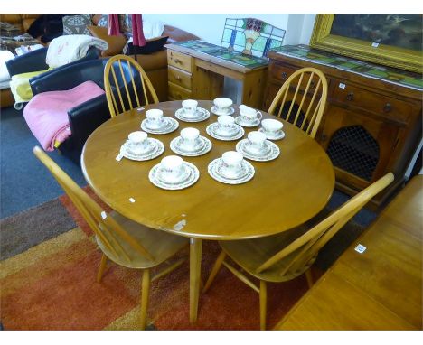 BLONDE ERCOL D-ENDED DROP LEAF DINING TABLE on squared tapering legs, width 123cms, and four Ercol spindle back dining chairs