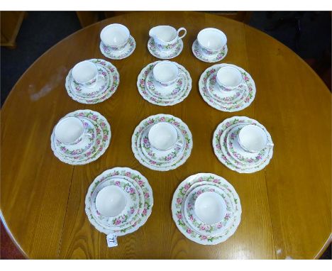 COLCLOUGH THIRTY EIGHT PIECE PINK CABBAGE ROSE TEASET comprising eight cups, saucers and plates, eight side plates, two sugar