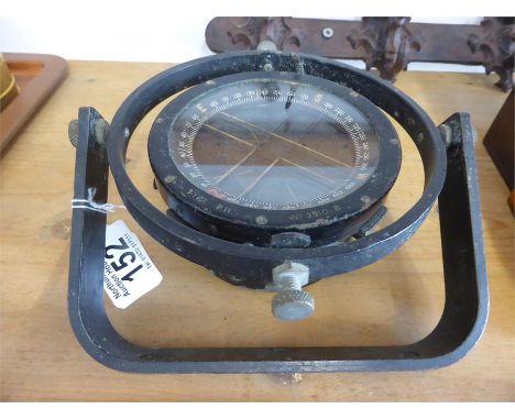 VINTAGE SHIP'S COMPASS with enamelled dial set in cast metal frame with gimbal mechanism