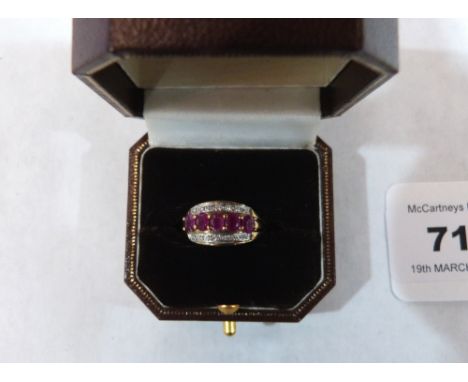 A ruby and white stone ring. In gold marked 9K. 2.4 g gross. Size M